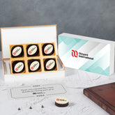 Event‑themed wooden box filled with branded chocolates