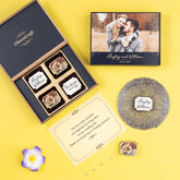 Wedding party favors in a 4-chocolate black wooden box with custom wedding design