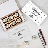 Open six‑piece real estate closing gift box with custom chocolates