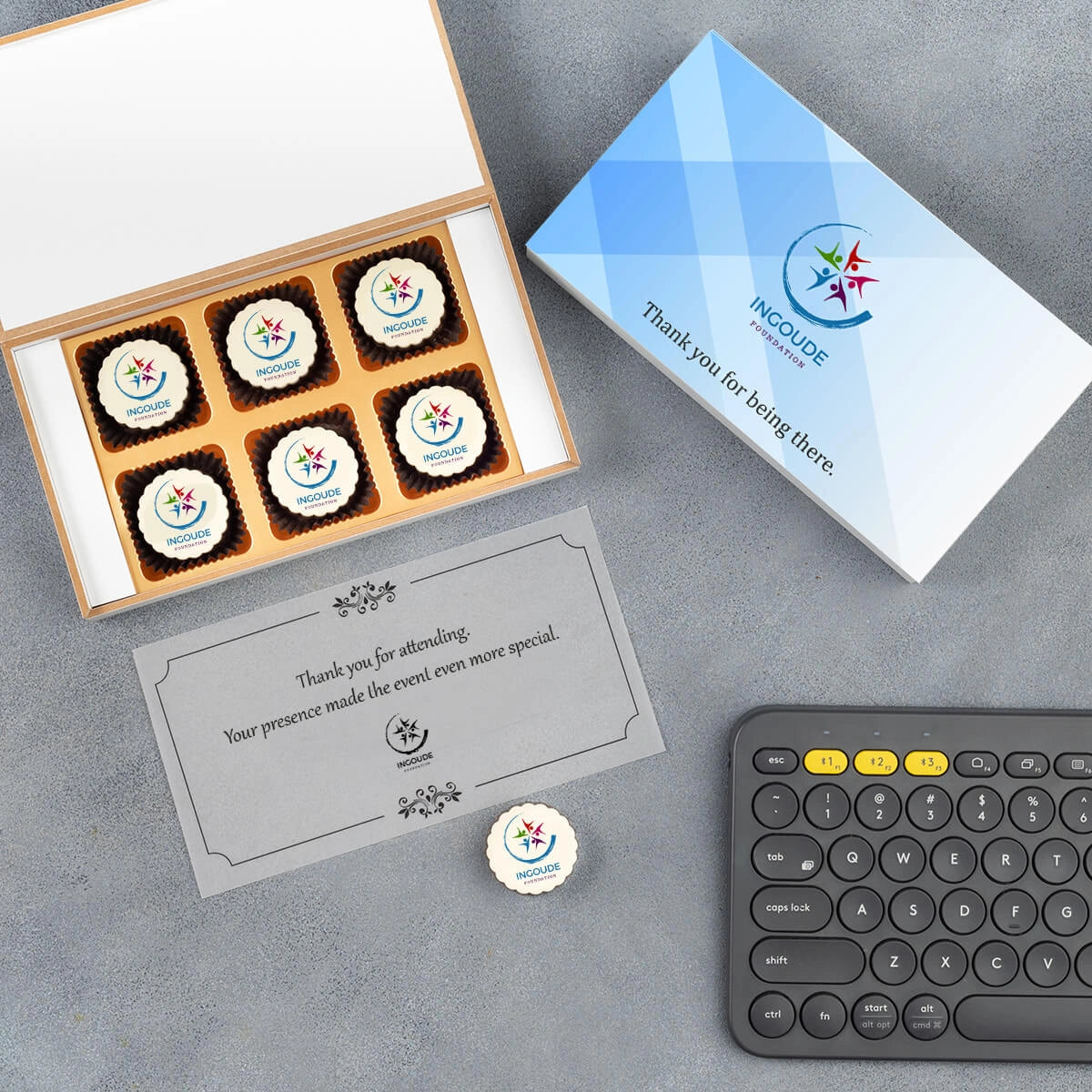 White wooden box display with printed chocolates and thank‑you message