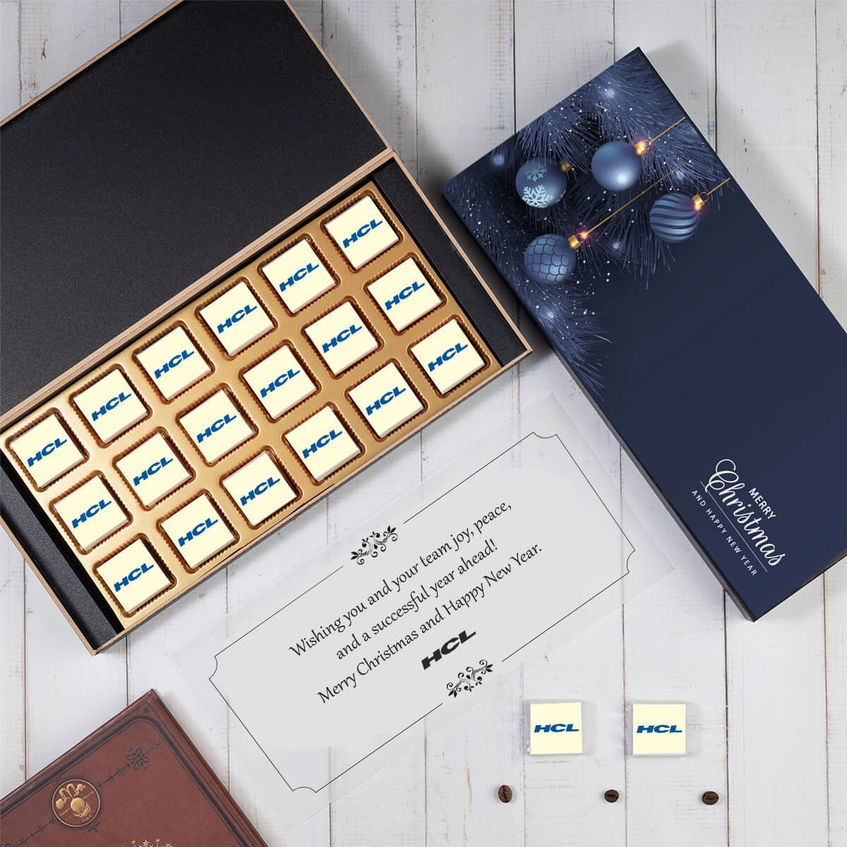Top perspective of luxury corporate chocolate gift box showcasing custom logo-wrapped chocolates.