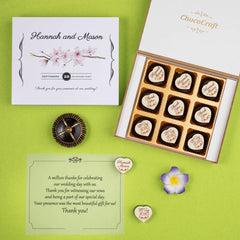 Party favors for wedding guests sample in a 9-chocolate wooden box with custom design