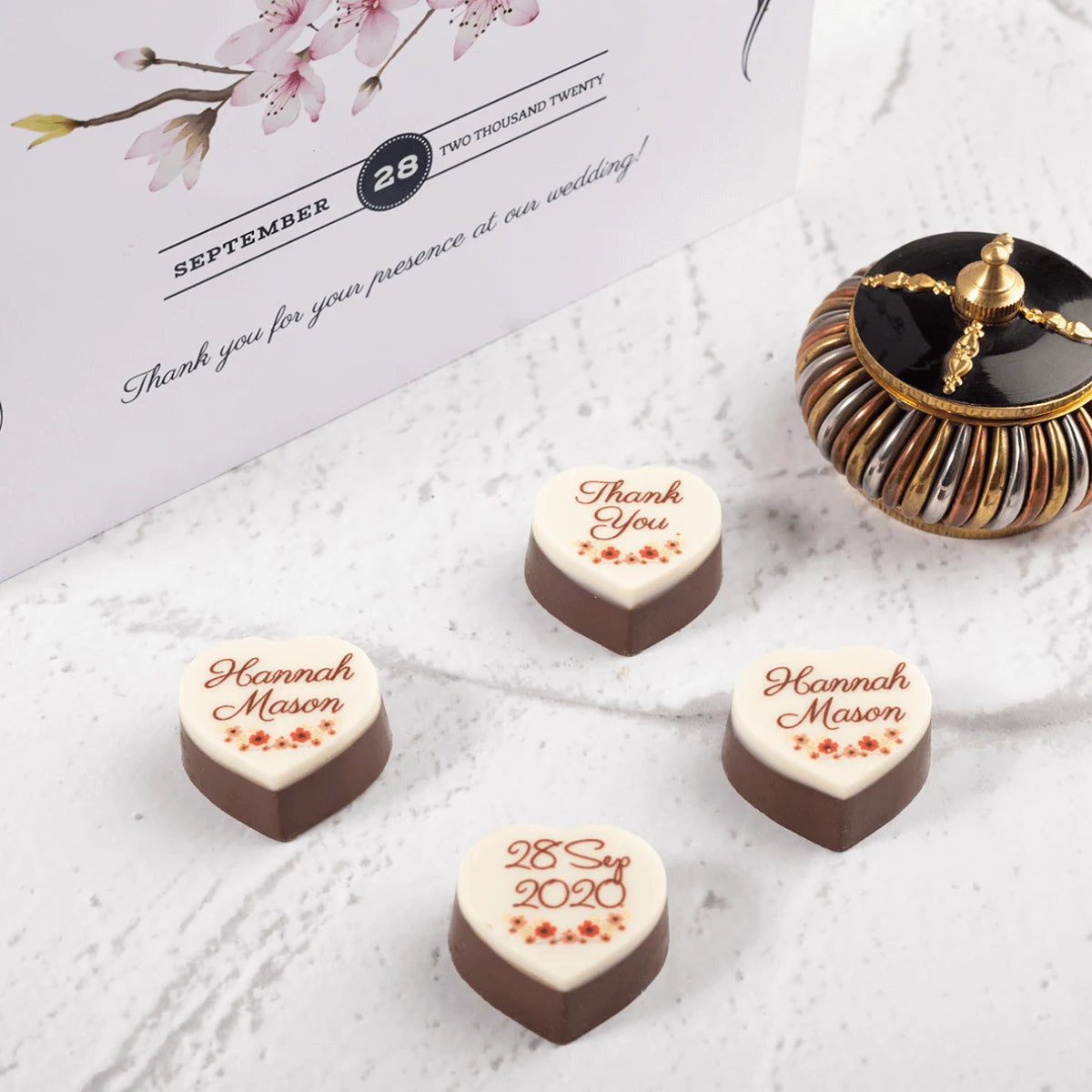 Personalized wedding souvenirs design sample with nine customized chocolates for guests