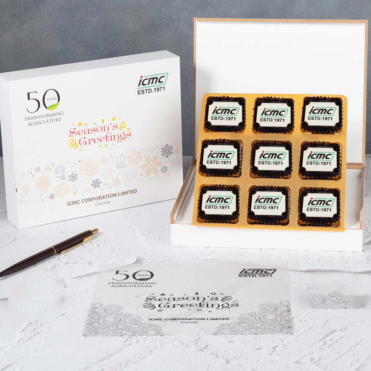Holiday‑themed anniversary box with 9 festive printed chocolates – corporate celebrations