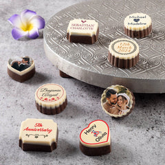 Multiple photo printed chocolates arranged in anniversary invite box