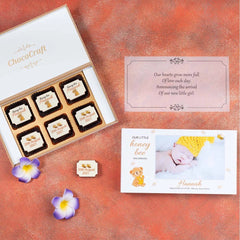 birth announcement chocolates packed with personalized butter paper