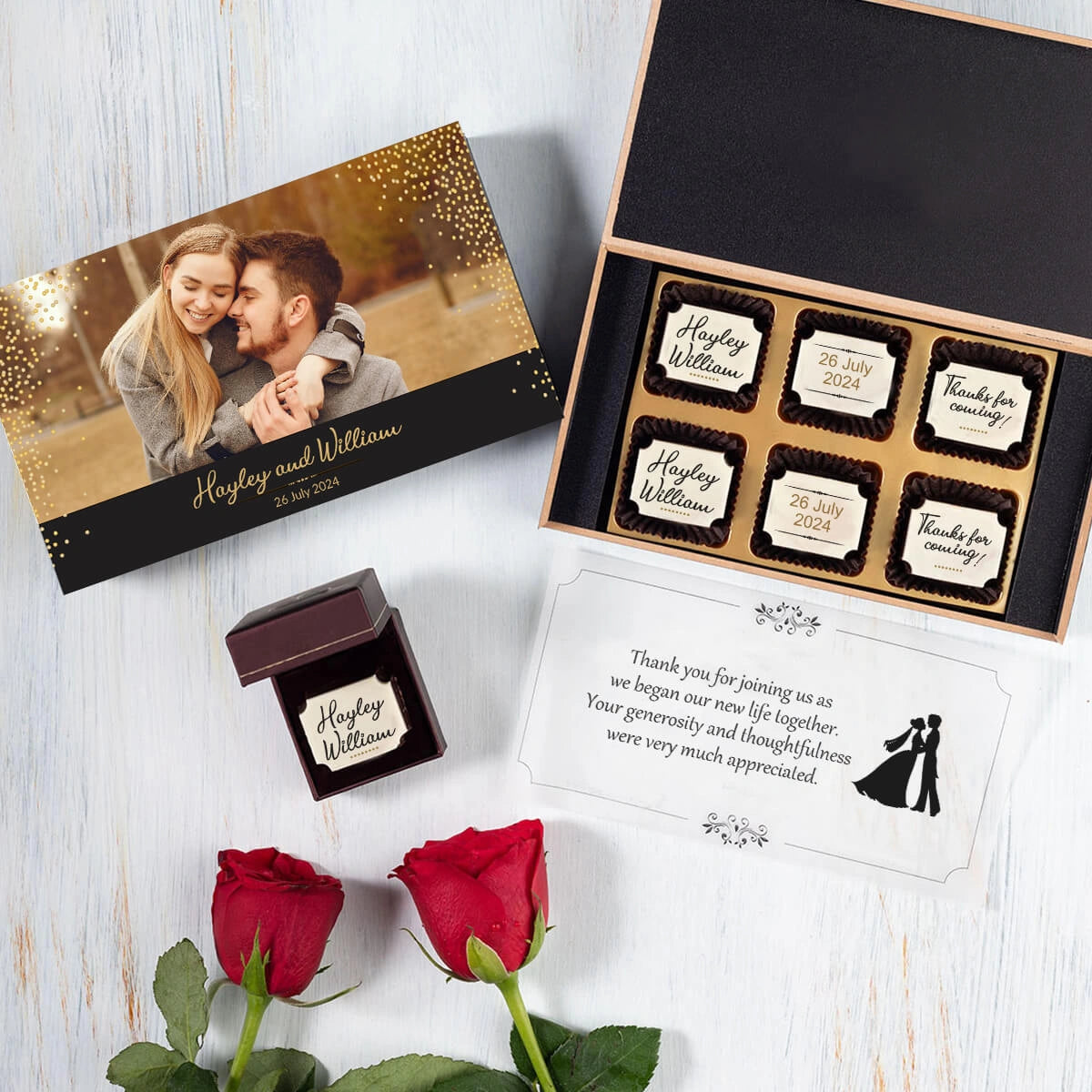 Close-up of black wedding favor box lid with printed design