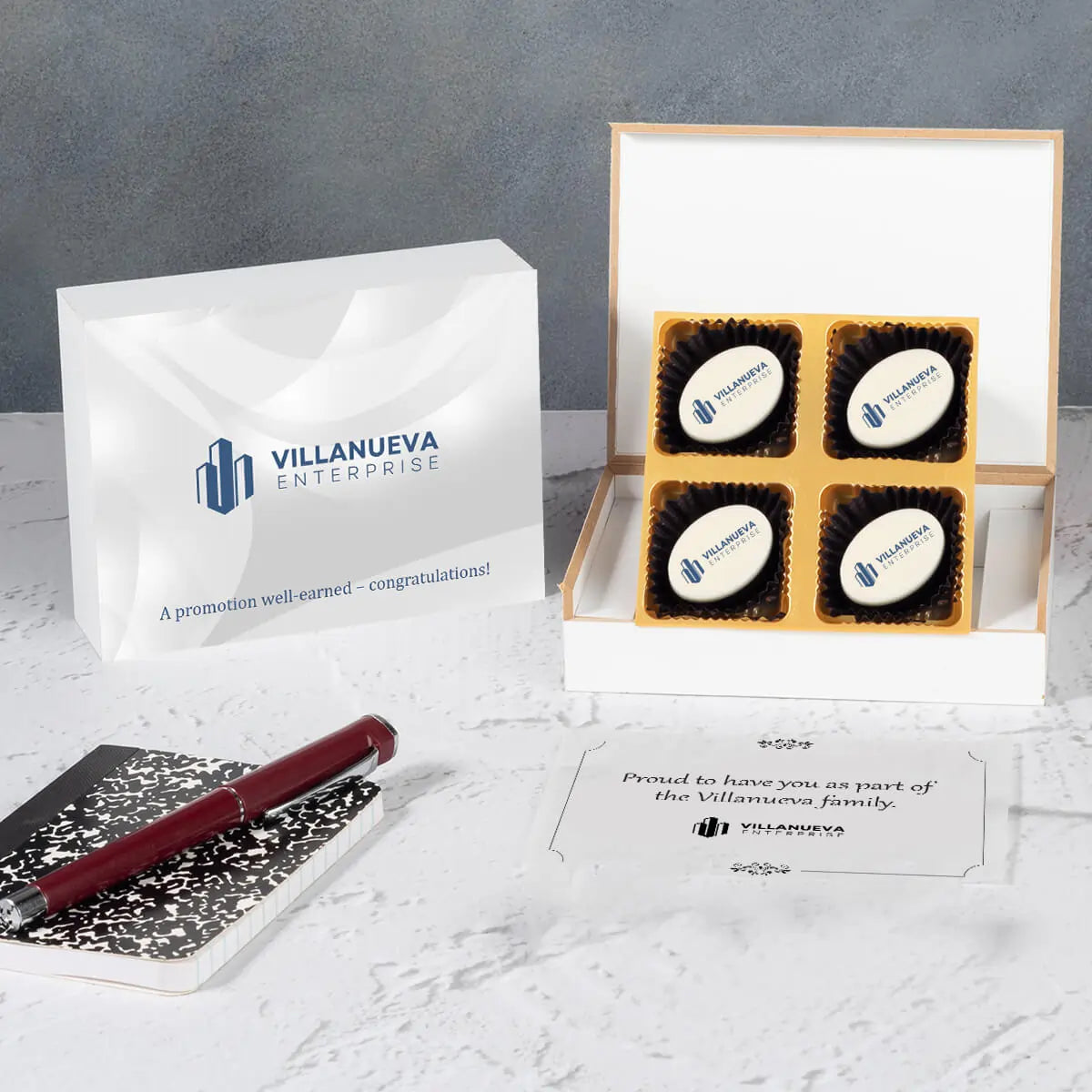 Wooden gift box open showing logo chocolates