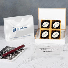 Wooden gift box open showing logo chocolates