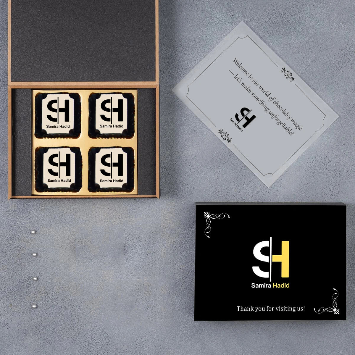 Premium wooden box holding 4 logo‑chocolates sample
