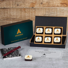 Wooden box open to reveal logo chocolate assortment