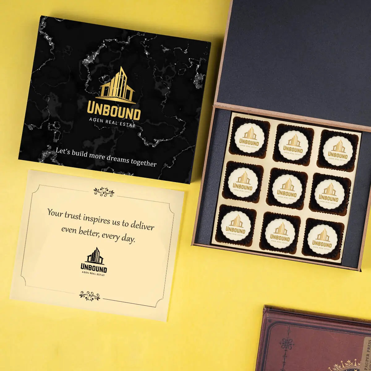 9-piece chocolate box with branded chocolates for real estate clients