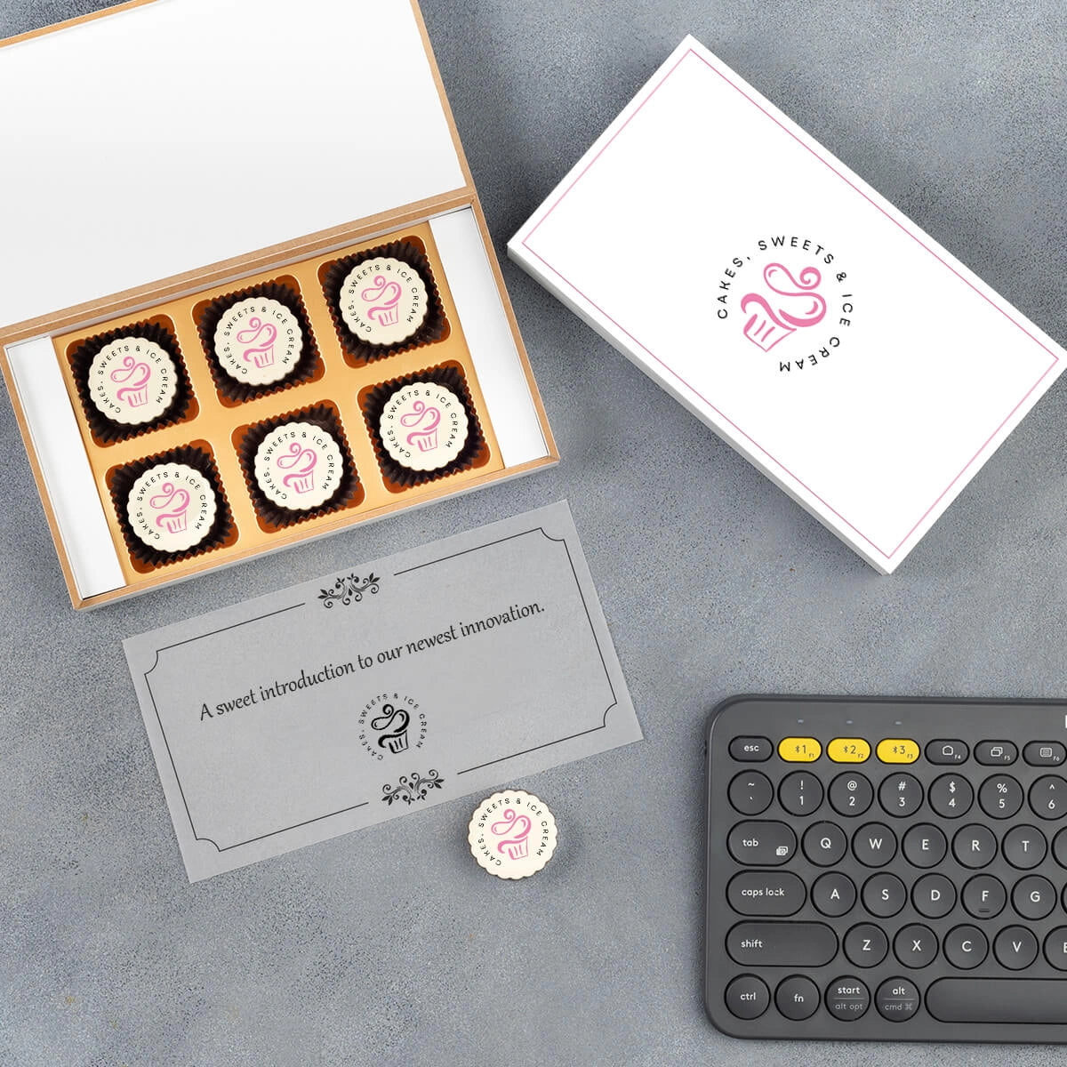 Premium launch gift box opened with printed chocolates inside