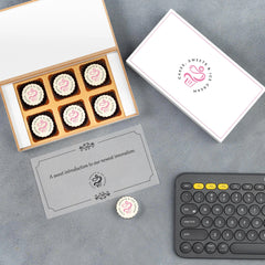Premium launch gift box opened with printed chocolates inside