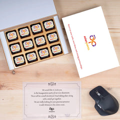 Branded chocolate assortment in open white wooden gift box.