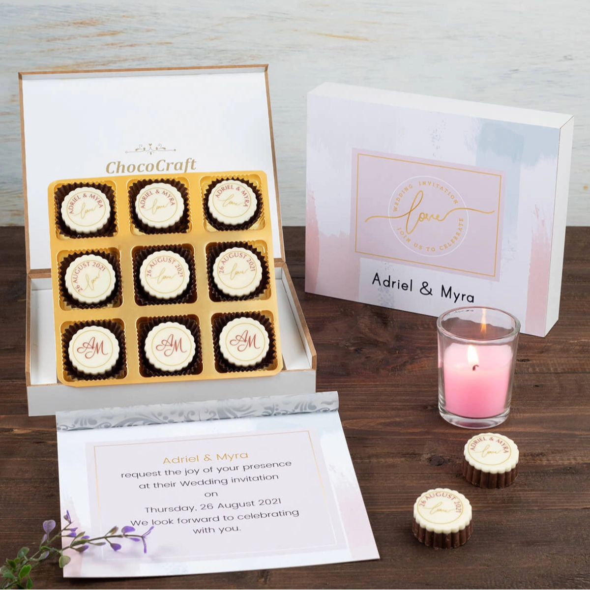 Open chocolate invitation box with printed chocolates and message insert
