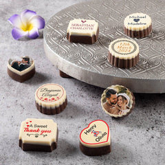 Guests receiving personalized anniversary chocolate favor boxes