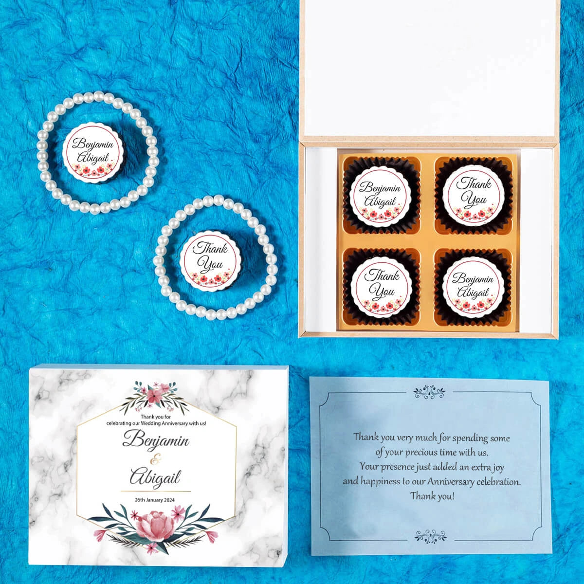 Personalized chocolate box given as favor to anniversary guests