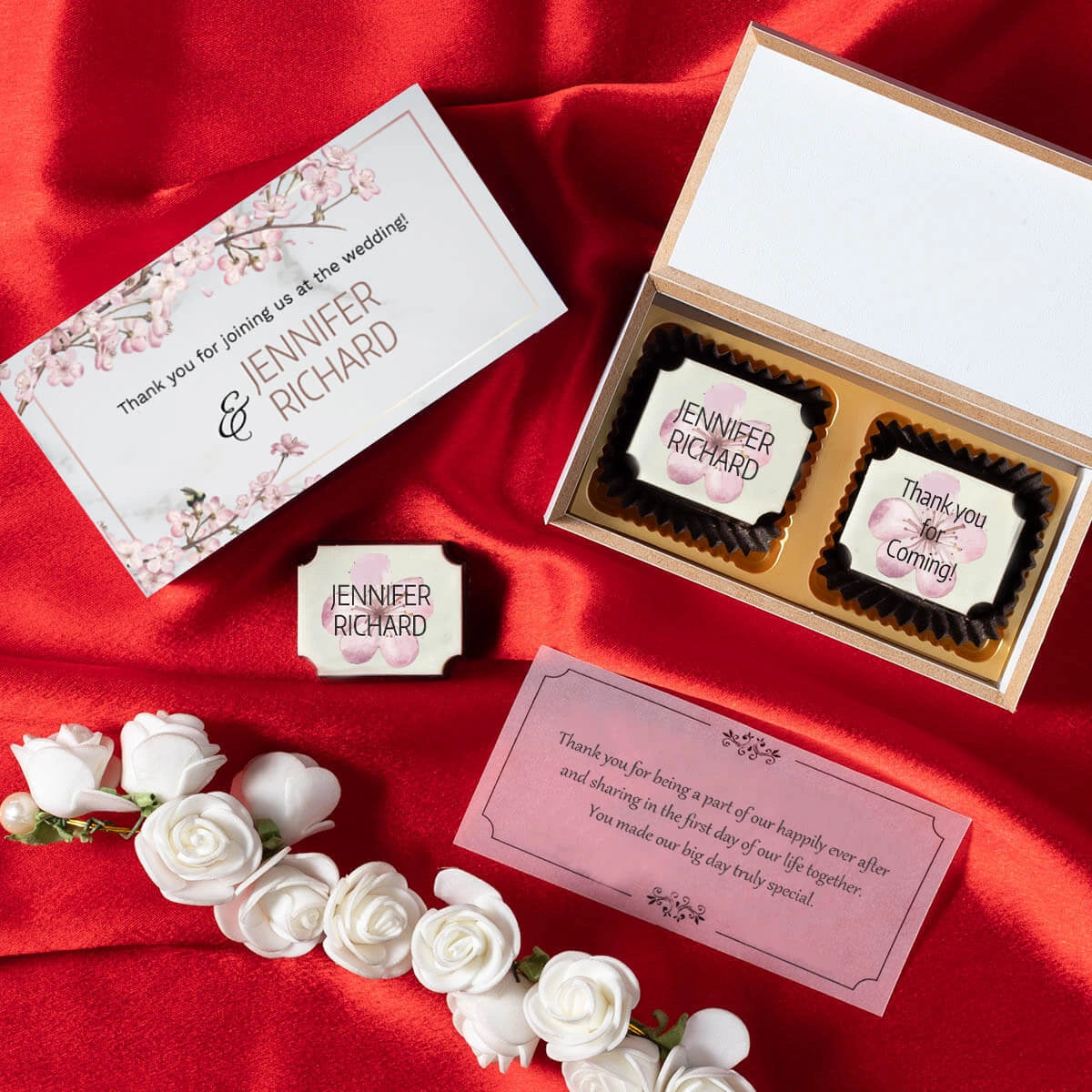 White wooden wedding favor box with two personalized printed chocolates