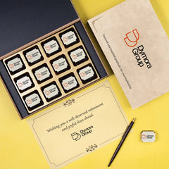 Open ChocoCraft retirement gift box with printed chocolates