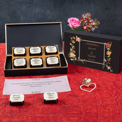 Sample anniversary party favor box with printed chocolates