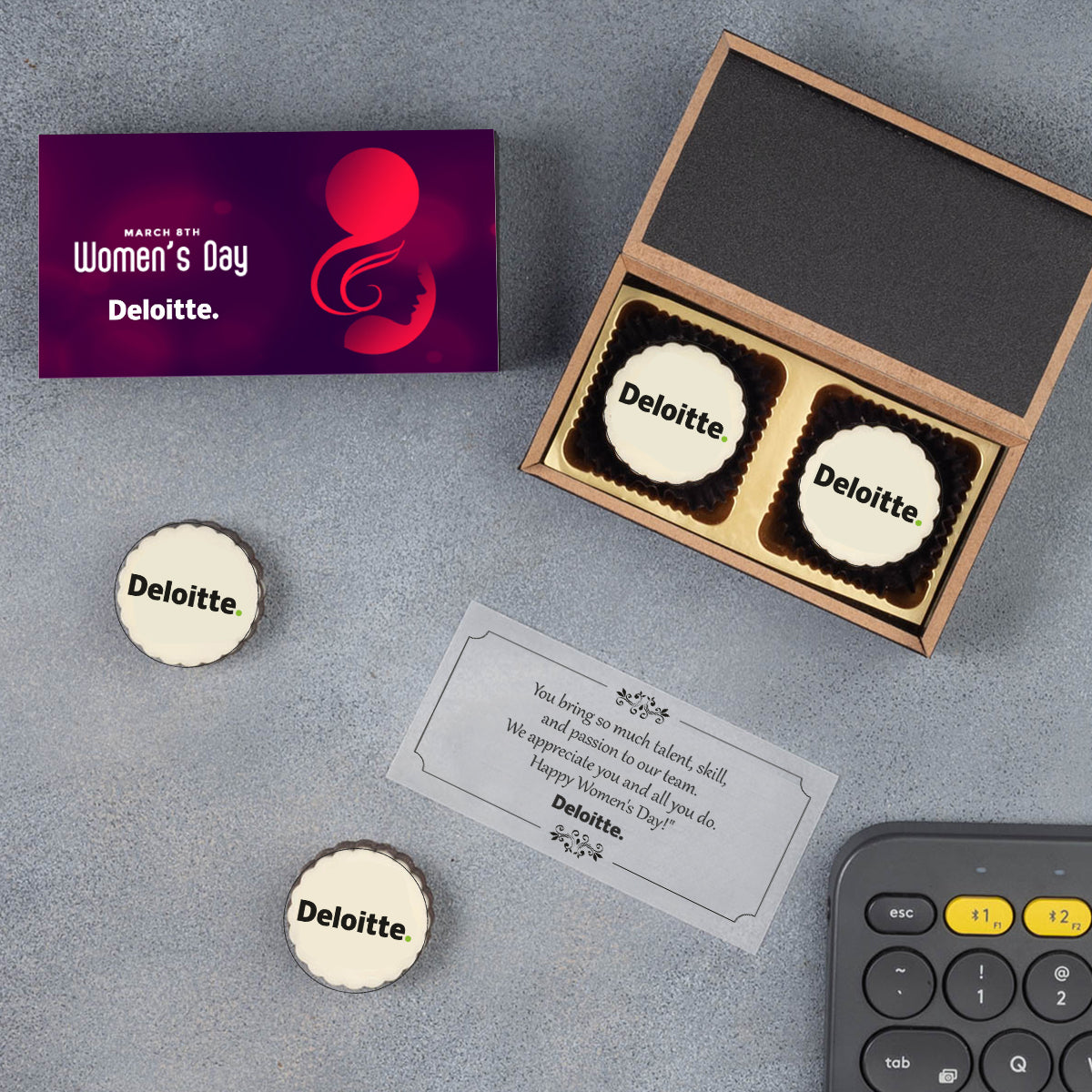 Open Women’s Day gift box showing two personalized chocolates inside